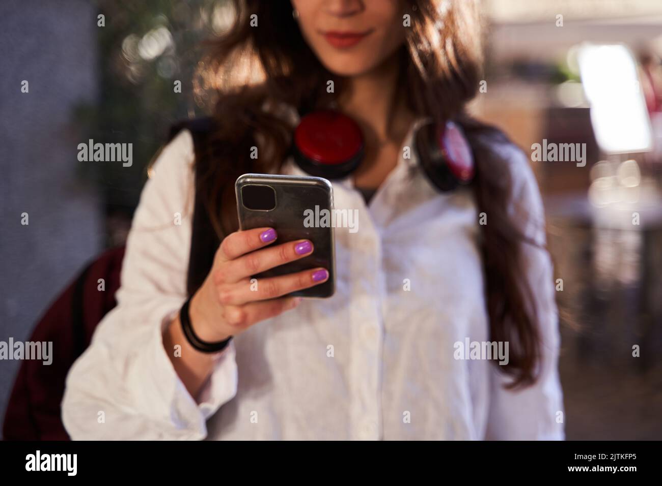 detail of an unrecognizable Caucasian woman using her mobile phone Stock Photo