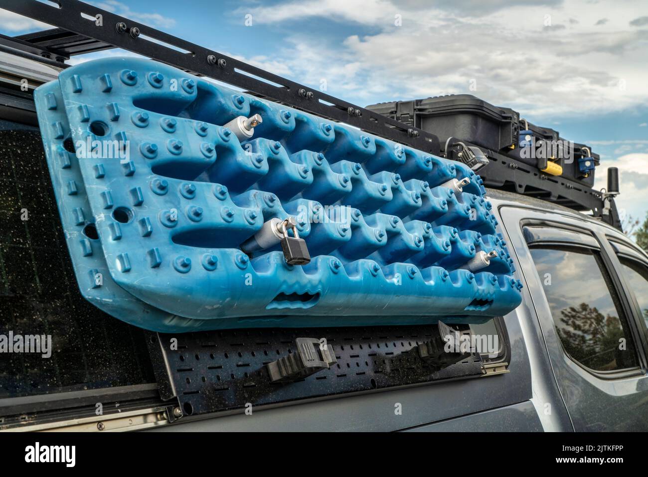 recovery traction ladders mounted on side racks of a truck, used to enhance tire traction in mud, snow or sand emergency conditions Stock Photo