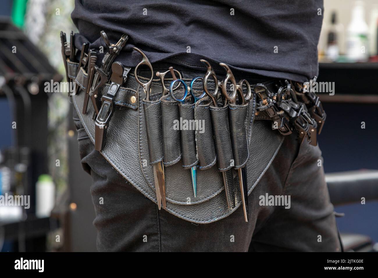 Leather barber belt with all the scissors at the waist Stock Photo Alamy
