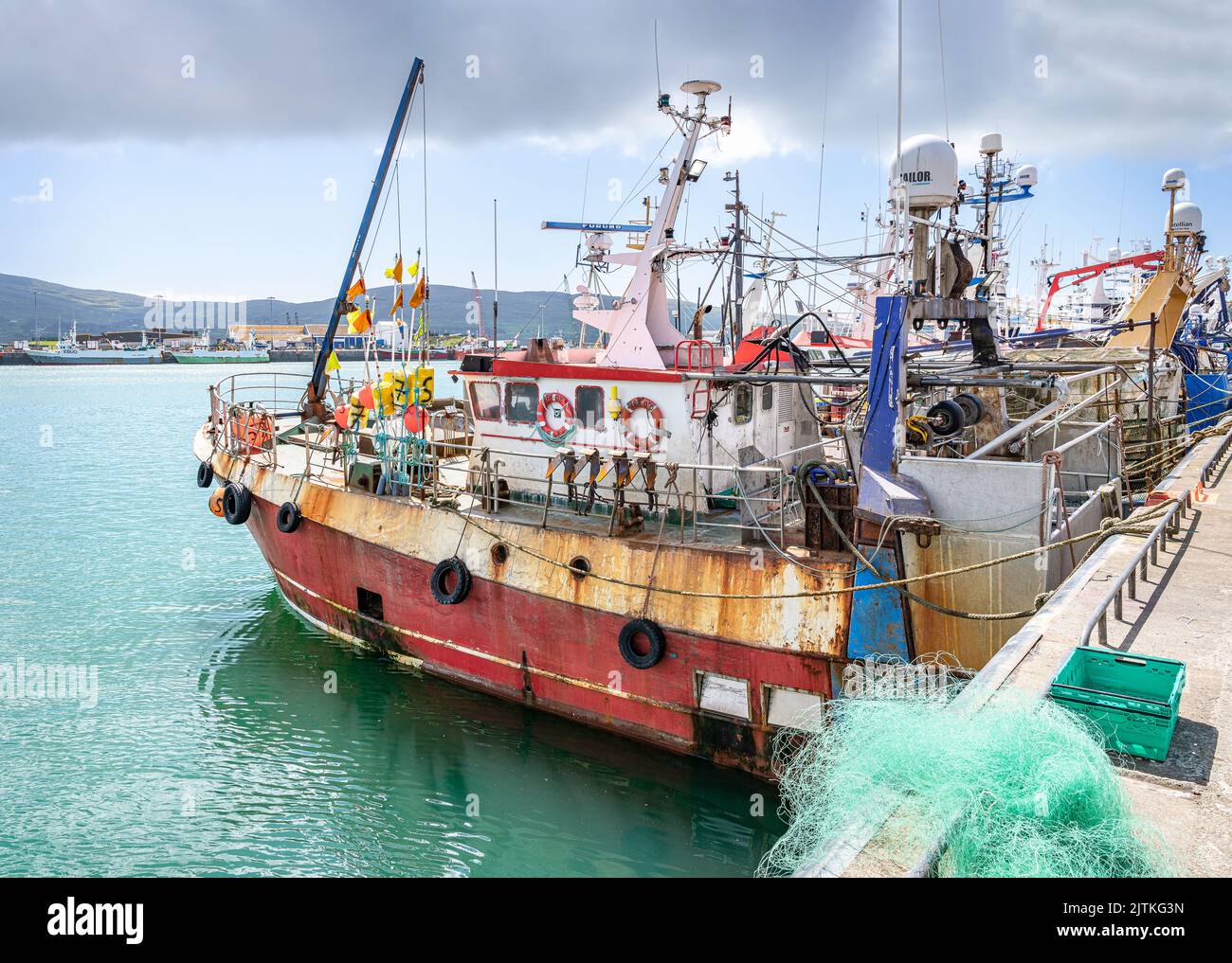 Fishing Boats lined up in the Harbour in Castletownbere, County Cork, Ireland Stock Photo