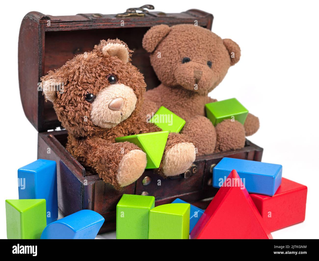 Plush bears and wooden building blocks against white background Stock Photo