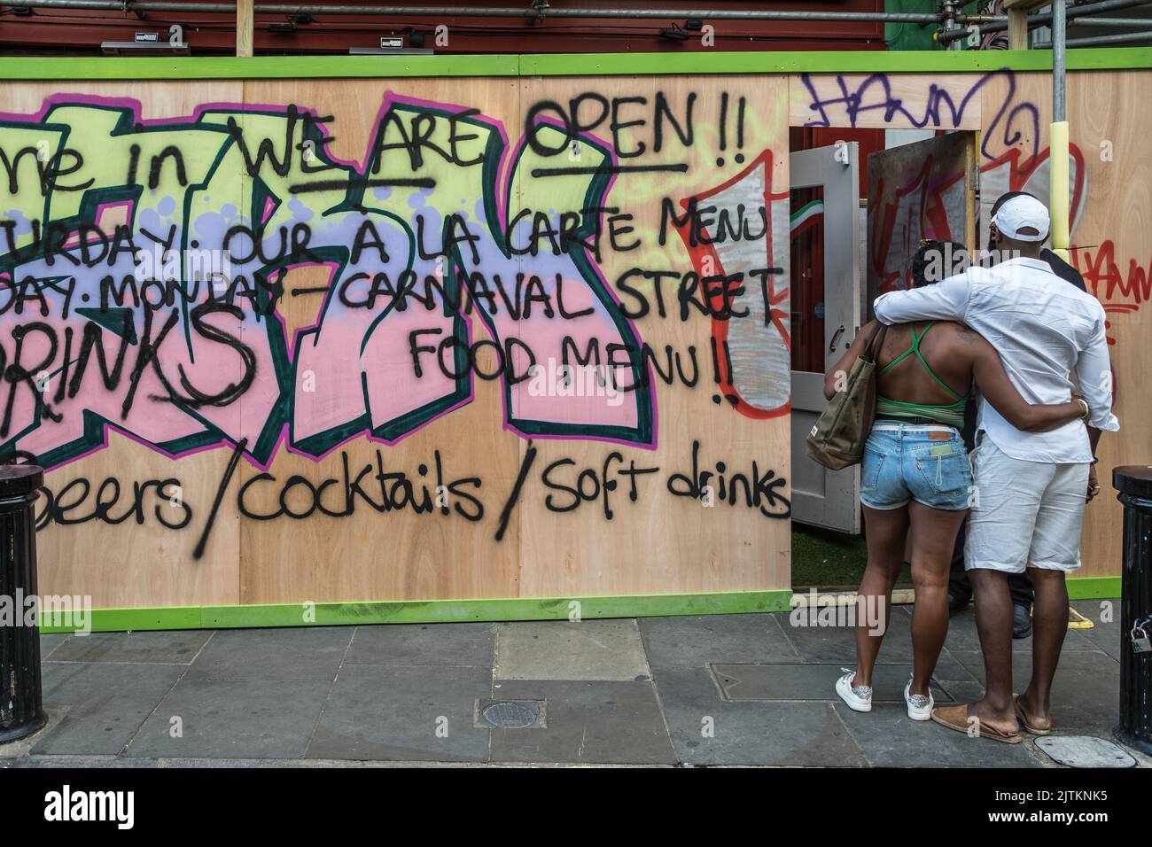 Boarded up shop covered in Graffiti, in preparation for the Notting Hill Carnival in West London, 2022. Stock Photo