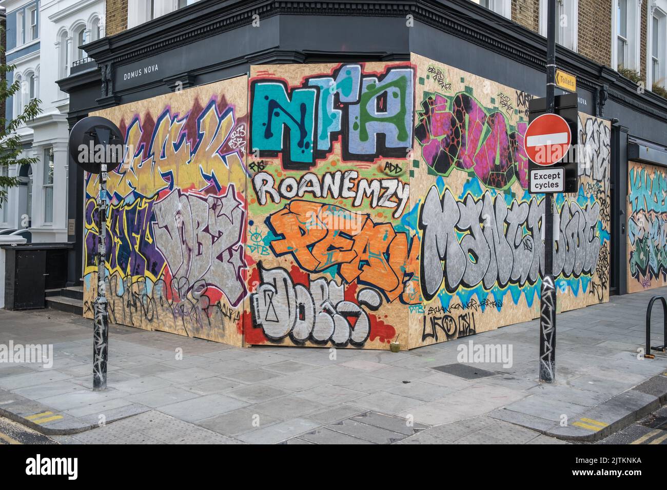 Boarded up shops covered in Graffiti, in preparation for the Notting Hill Carnival in West London, 2022. Stock Photo