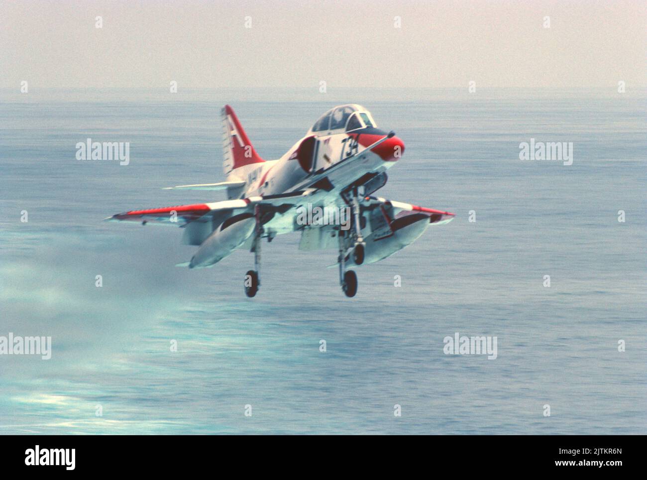 Douglas A-4 Skyhawk training aircraft conducting carrier quals at sea Stock Photo