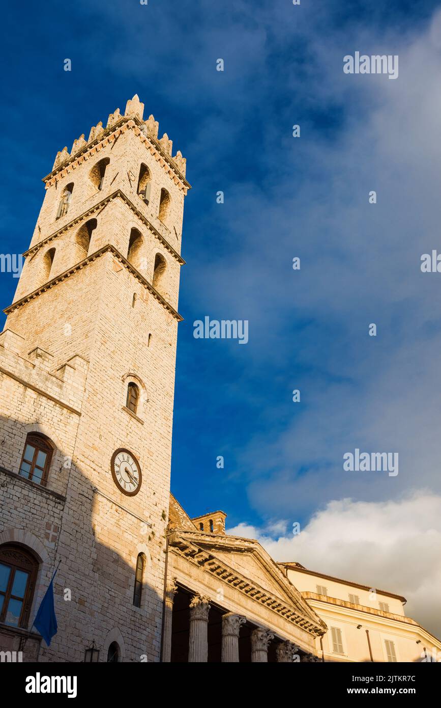 Medieval People's Tower in Assisi Communal Square, a city landmark, with clouds Stock Photo