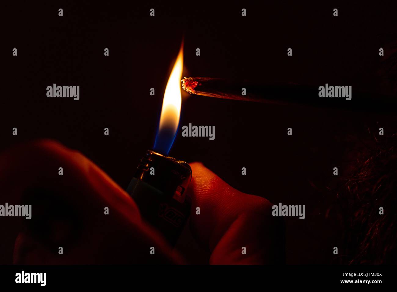 Lighting a marijuana joint, smoke Stock Photo Alamy
