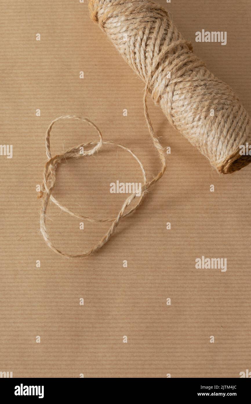 Brown parcel packaging paper, with string, for wrapping parcels. Eco