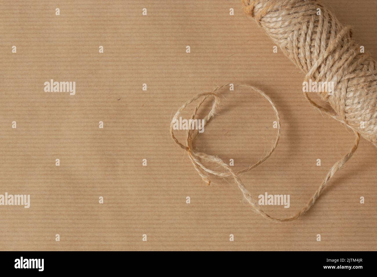 Brown parcel packaging paper, with string, for wrapping parcels. Eco