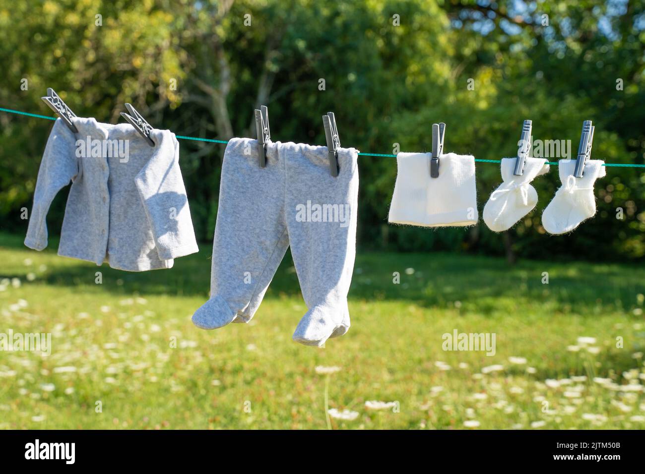 baby clothes dry in the sun Stock Photo Alamy