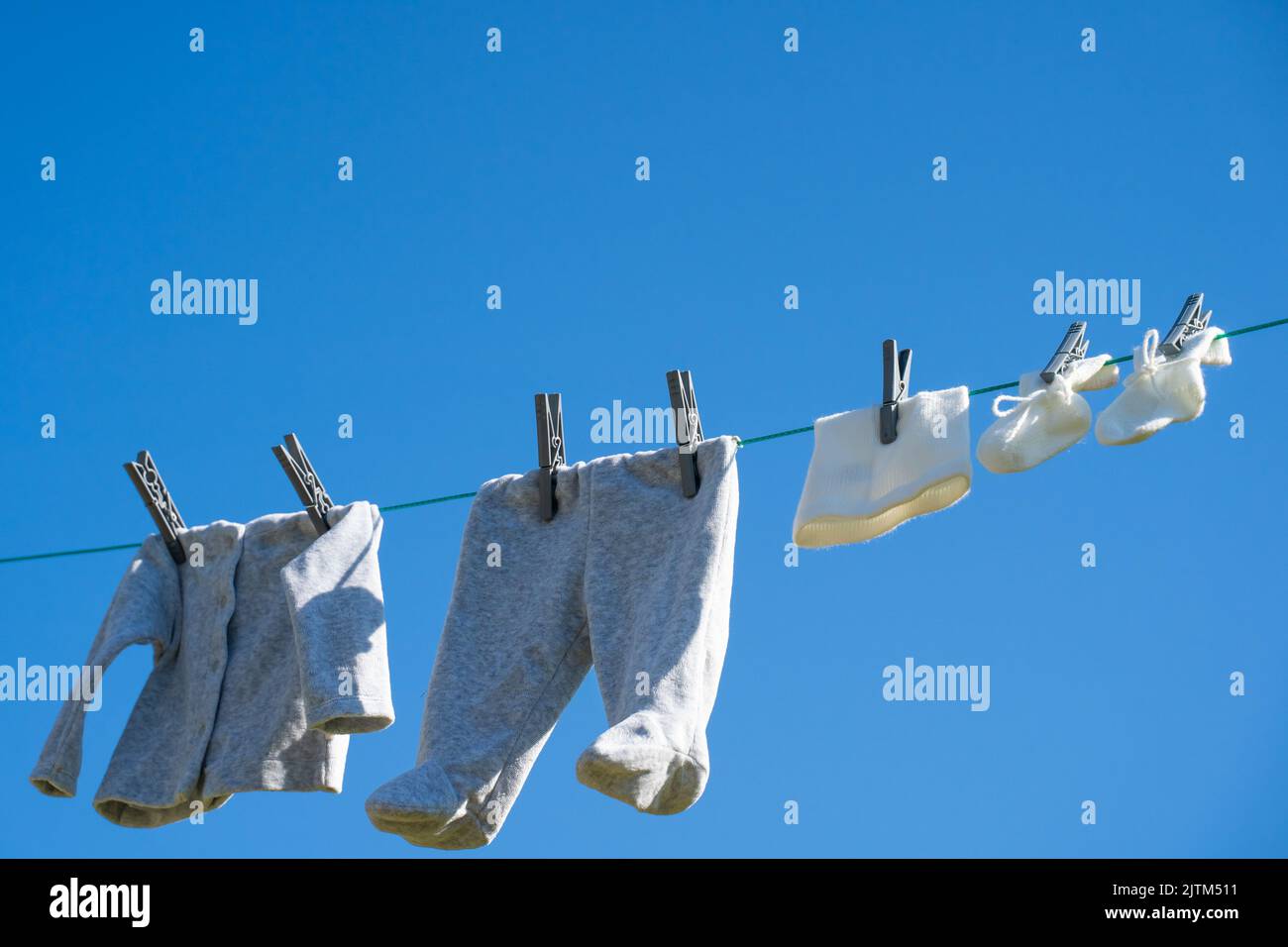 baby clothes dry in the sun Stock Photo - Alamy