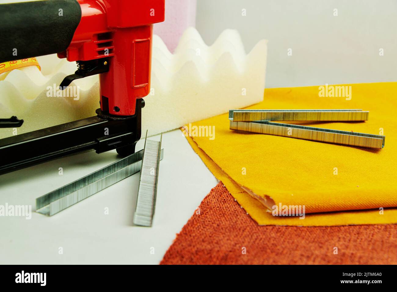 concept of furniture production and repair. Stapler and staples