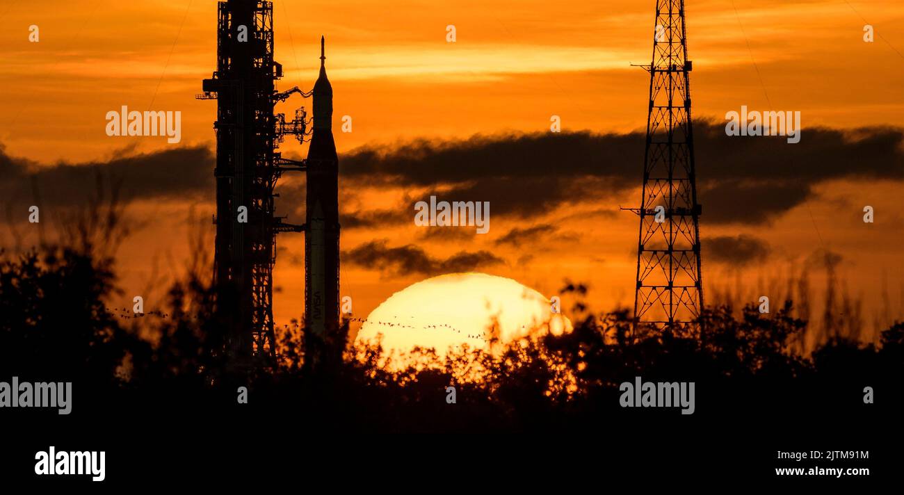 Kennedy Space Center, United States of America. 31 August, 2022. The NASA Space Launch System rocket with the Orion spacecraft is silhouetted by the rising sun on Launch Complex 39B at the Kennedy Space Center, August 31, 2022, in Cape Canaveral, Florida. The countdown for the un-crewed flight test has been rescheduled for September 3rd following a problem with the fuel system caused an extended delay. Credit: Bill Ingalls/NASA/Alamy Live News Stock Photo