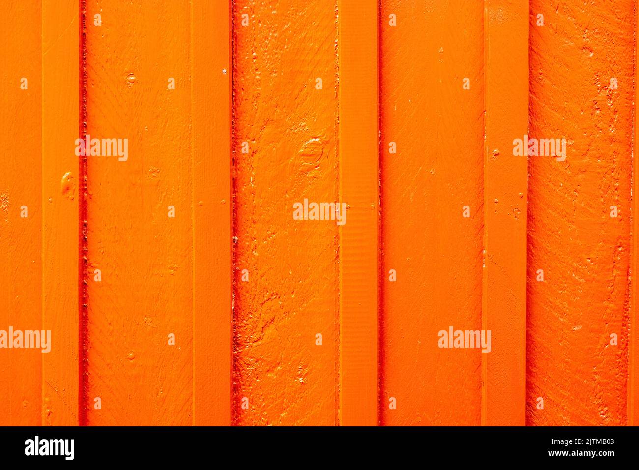 Background orange wall made of painted wooden planks Stock Photo