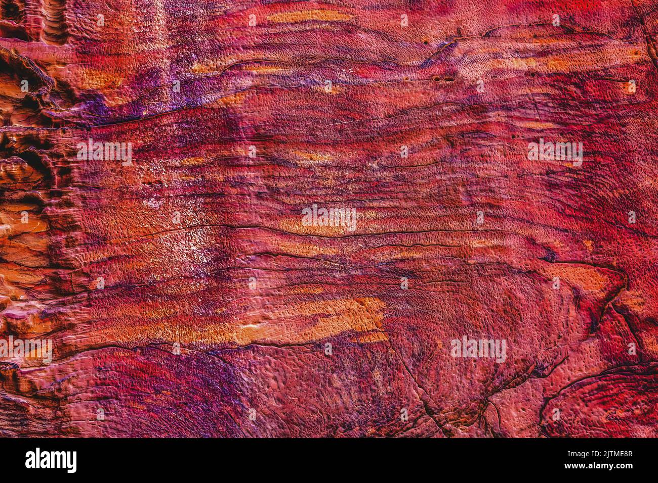 Rose Red Rock Tomb Facade Abstract, Street of acades Petra Jordan Built by  Nabataens in 200 BC to 400 AD  Red canyon walls create many abstracts clos Stock Photo