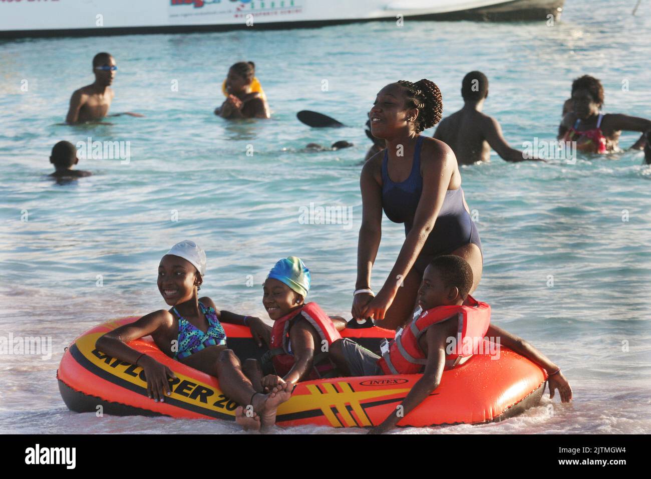 Beach time for students on vacation in barbados hires stock