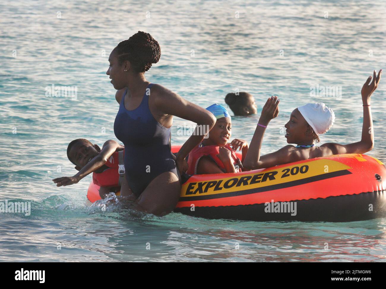 Schools vacation time at the beach in barbados hires stock photography