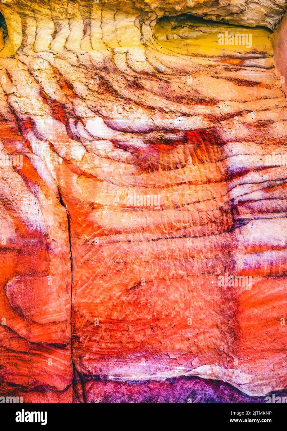 Red White Rock Abstract Petra Jordan Built by Nabataens in 200 BC to 400 AD Canyon walls create many abstracts close up Stock Photo
