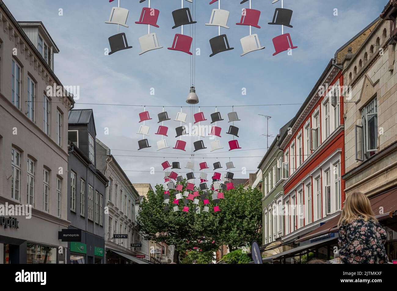 H C Andersen top hats hanging over a shopping street in the center of Odense, Denmark, August 28, 2022 Stock Photo