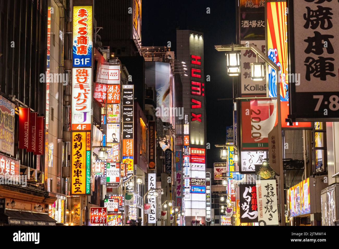 Neon signs along the red light and entertainment district of Shinjuku, Tokyo, Japan. Stock Photo