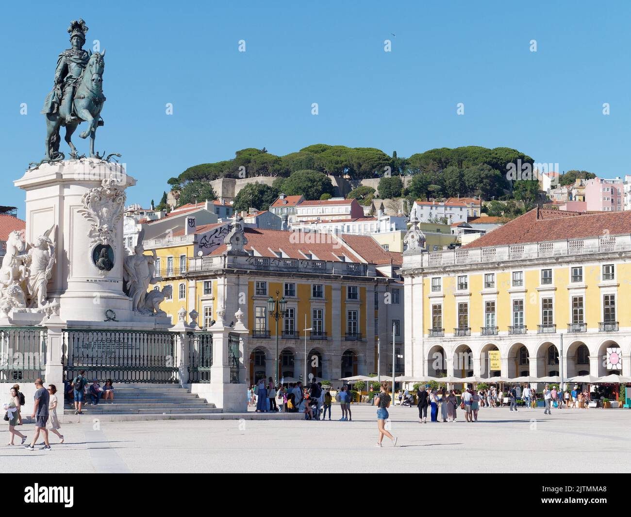 Praça do Comércio (Commerce Square) with equestrian statue and Castle of St. George on the hilltop behind. Lisbon, Portugal Stock Photo
