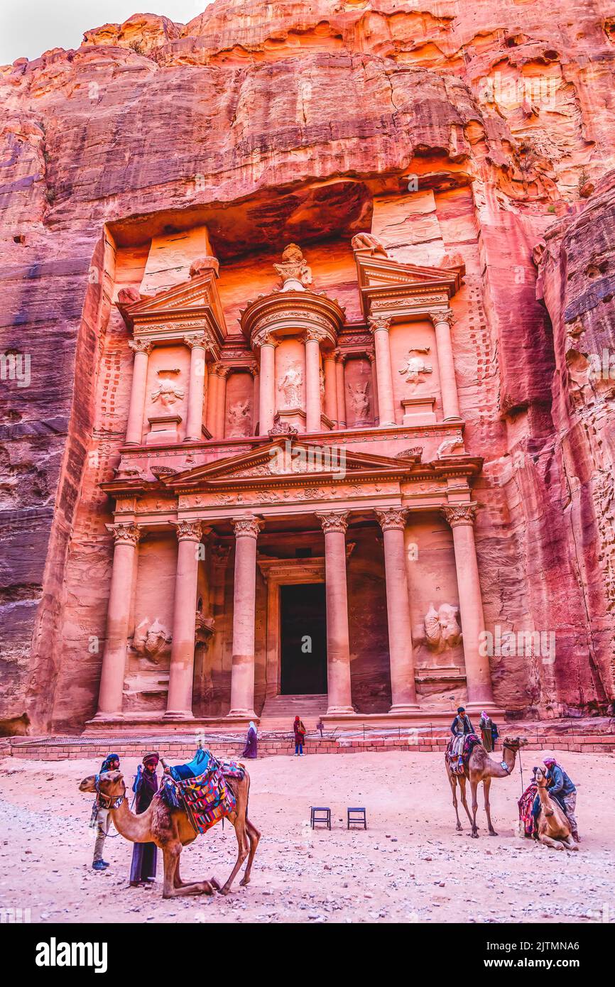 Rose Red Treasury Camels Siq Petra Jordan Treasury built by Nabataens in 100 BC. Yellow Treasury in Morning Becomes Rose Red in Afternoon when sun goe Stock Photo