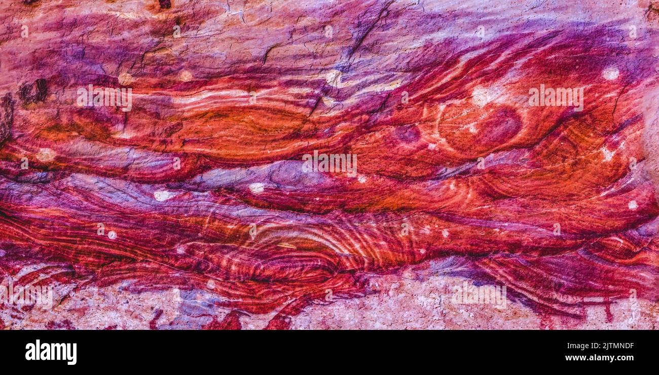 Red Rose Pink Rock Abstract Petra Jordan Built by Nabataens in 200 BC to 400 AD Canyon walls create many abstracts close up Stock Photo