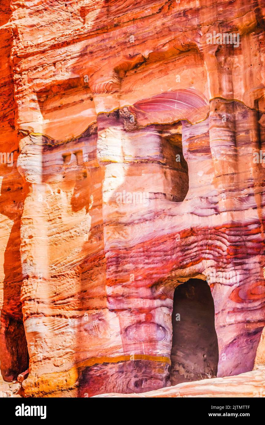 Colorful Red Blue Rock Tomb Petra Jordan Built by Nabataens in 200 BC to 400 AD. Canyon walls create many abstracts close up. Stock Photo