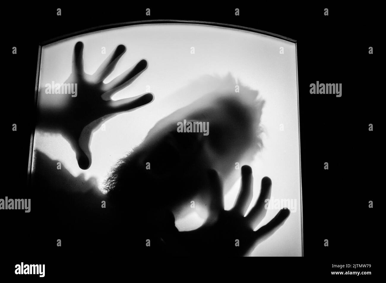 scary picture of hands behind glass, horror ghost behind door