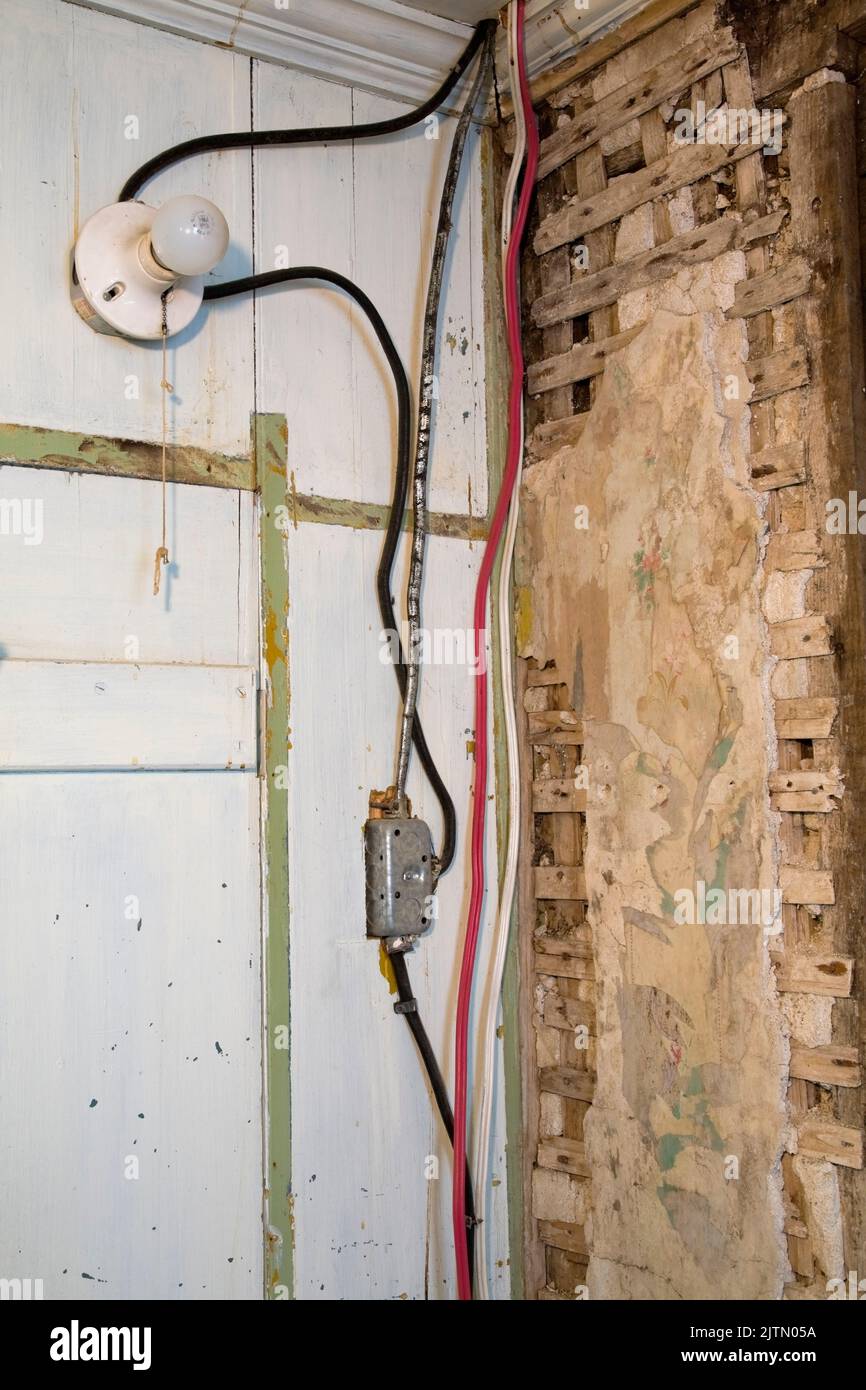 Old electrical cloth insulated and plastic wiring, light bulb fixture