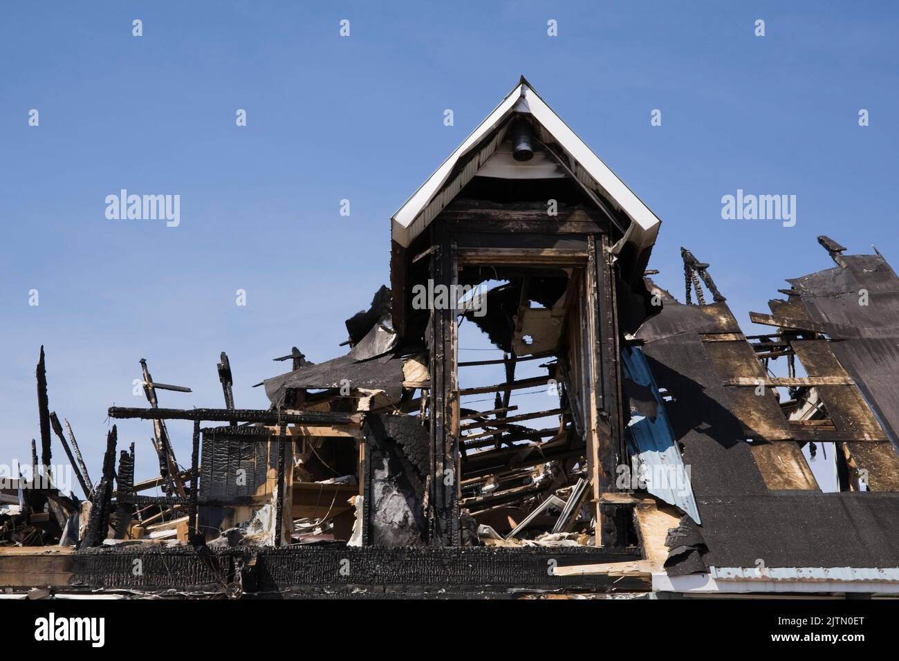Cottage style home damaged by fire Stock Photo - Alamy