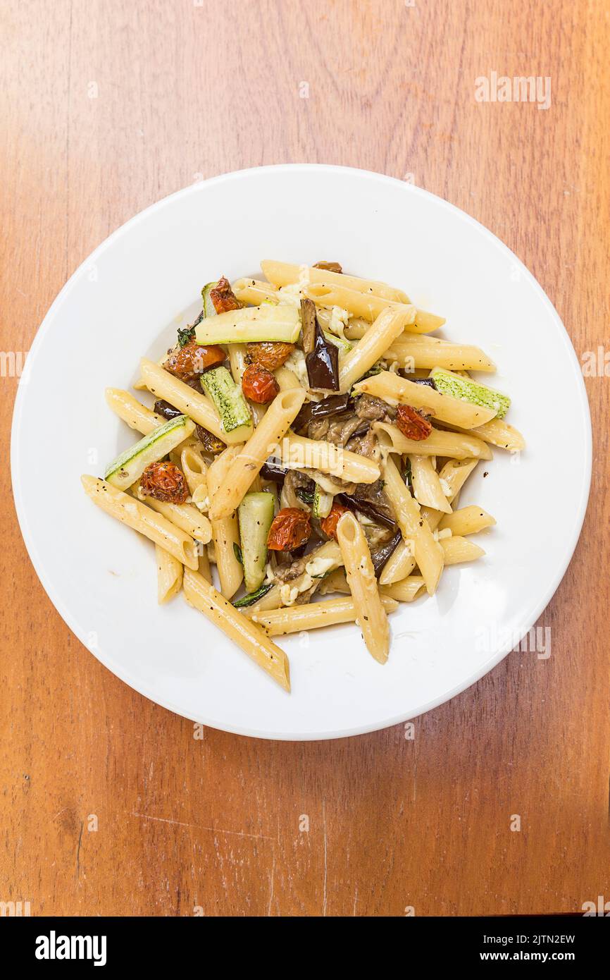 Italian pasta with sundried tomatoes, zuquini and melted parmesan