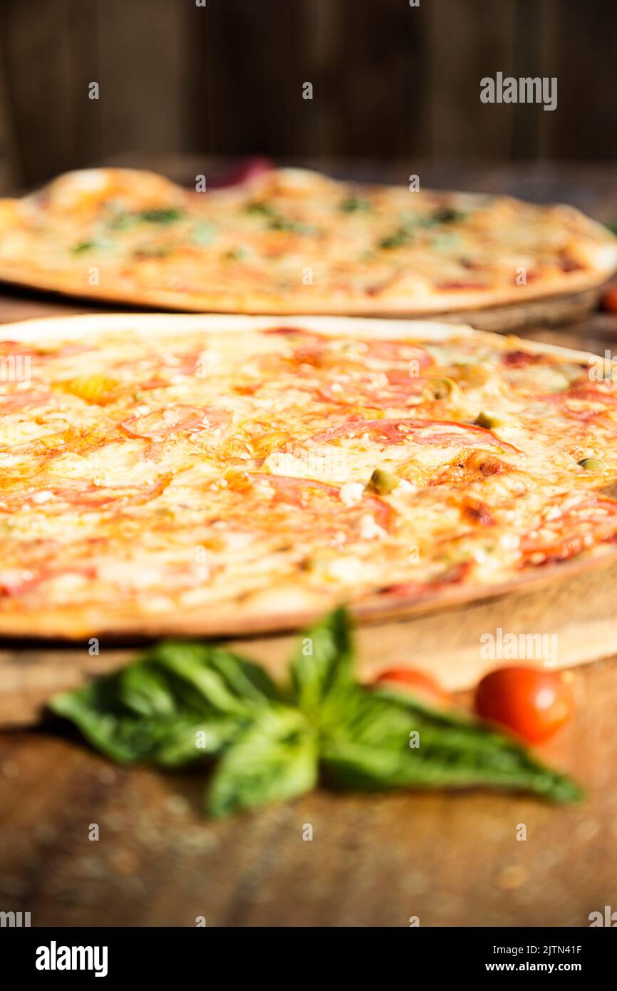 Italian pizza. Cheese and tomato. Potato and green onion. Italian restaurant. Quality pizza Stock Photo