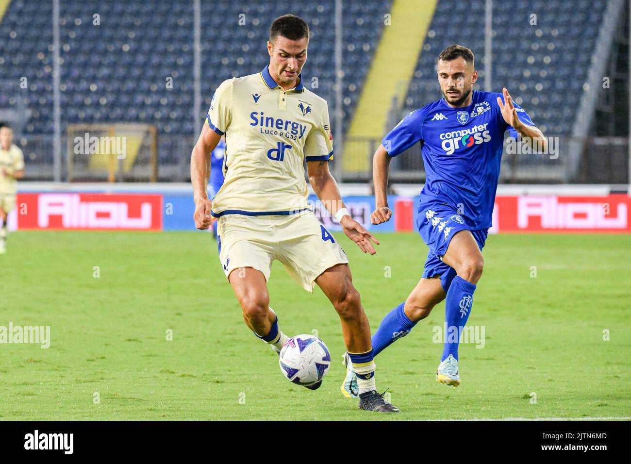 Empoli, Italy. 31st Aug, 2022. Hellas Verona's Miguel Pinto Veloso protects the ball against Empoliâ&#x80;&#x99;s Nedim Bajrami during Empoli FC vs Hellas Verona, italian soccer Serie A match in Empoli, Italy, August 31 2022 Credit: Independent Photo Agency/Alamy Live News Stock Photo