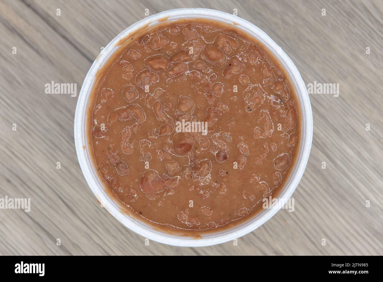 Overhead view of Mexican food needs a side order of authentic refried beans to complete the flavor of the meal. Stock Photo