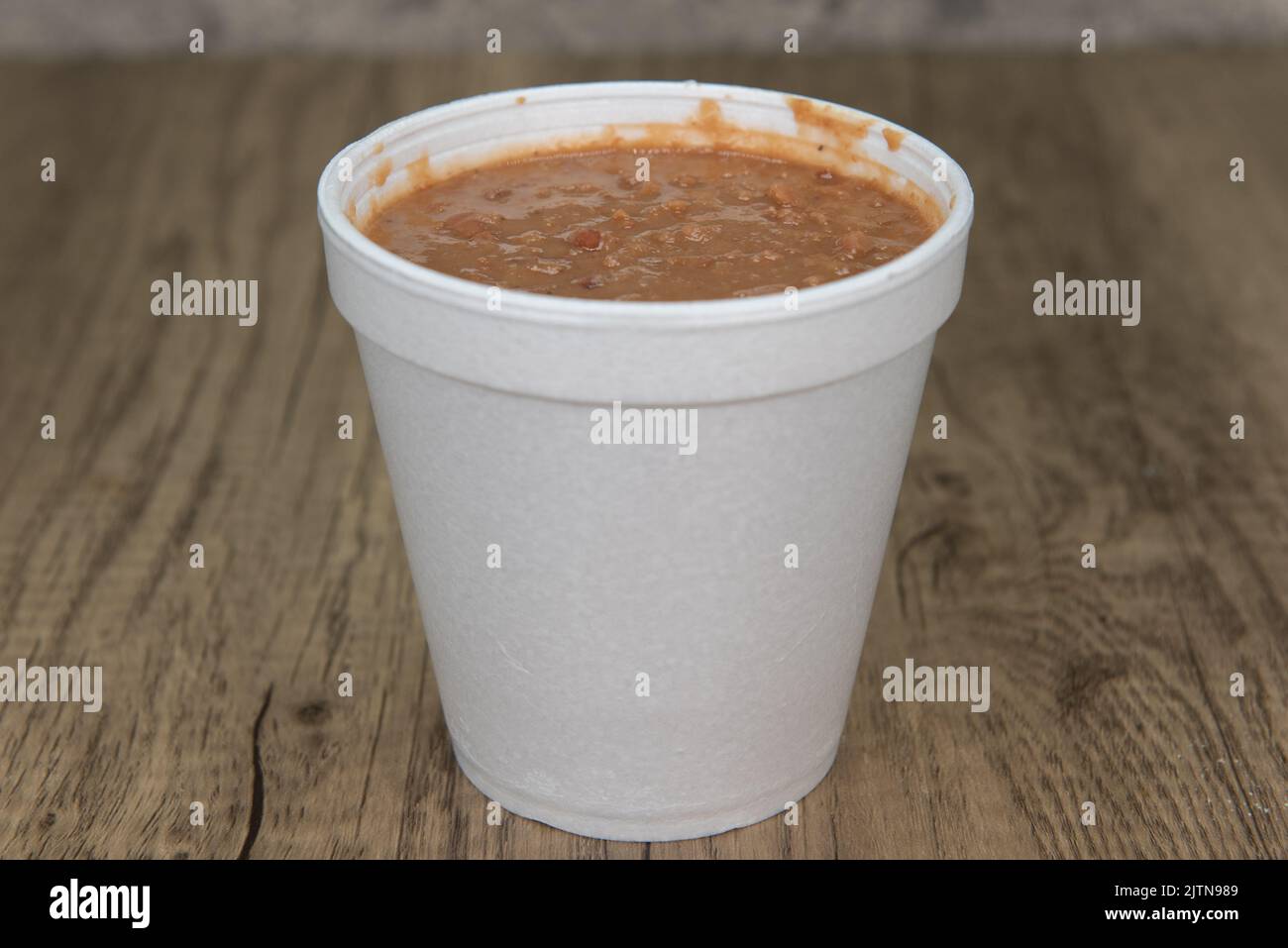 Mexican food needs a side order of authentic refried beans to complete the flavor of the meal. Stock Photo