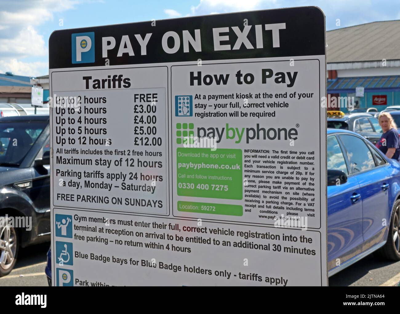 Parking signs,charges from PayByPhoone and ParkingEye, at Cockhedge Shopping & retail park at Warrington Town Centre,Cheshire,UK, WA1 Stock Photo