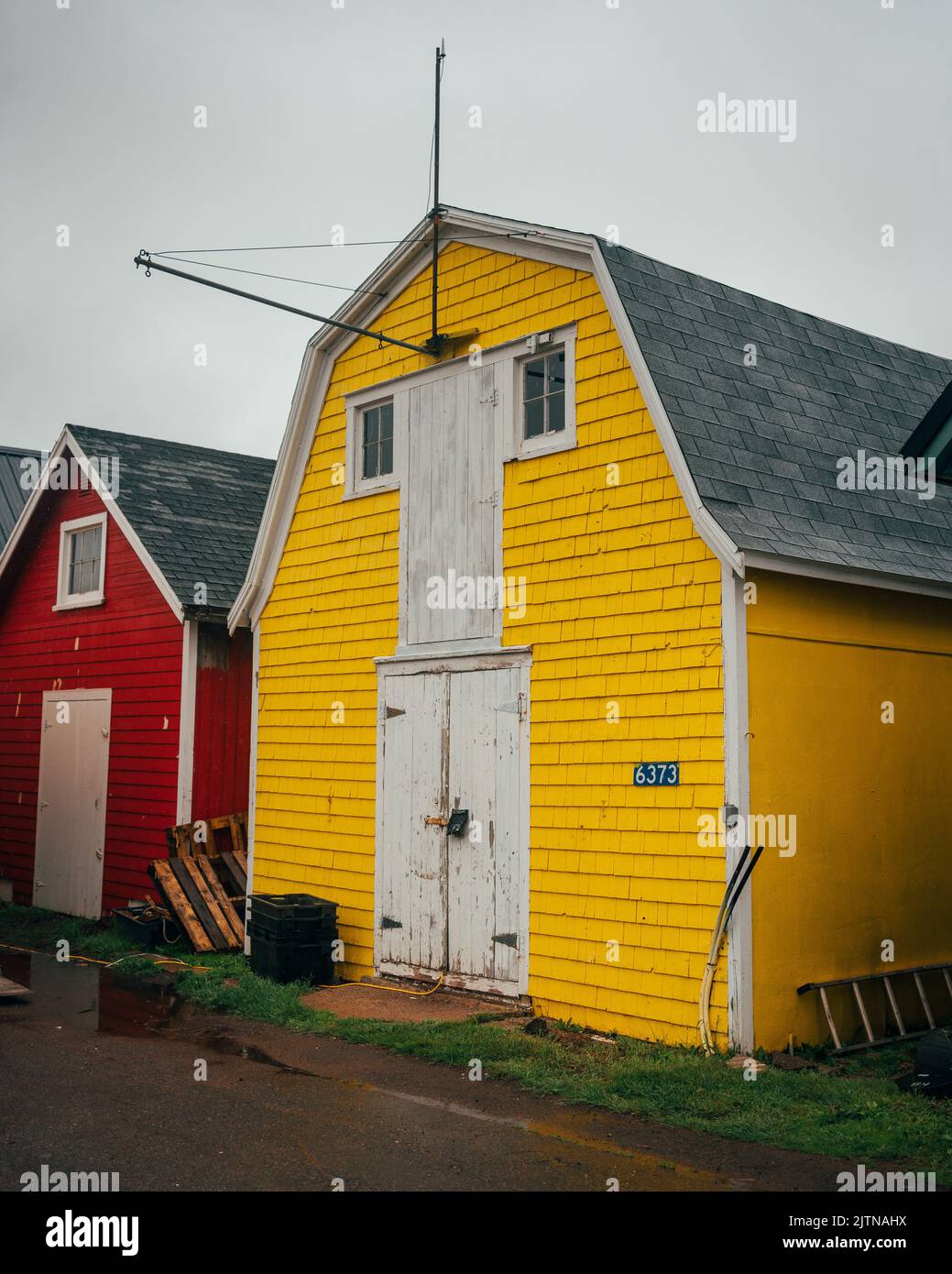 Yellow building at a harbor, Prince Edward Island, Canada Stock Photo