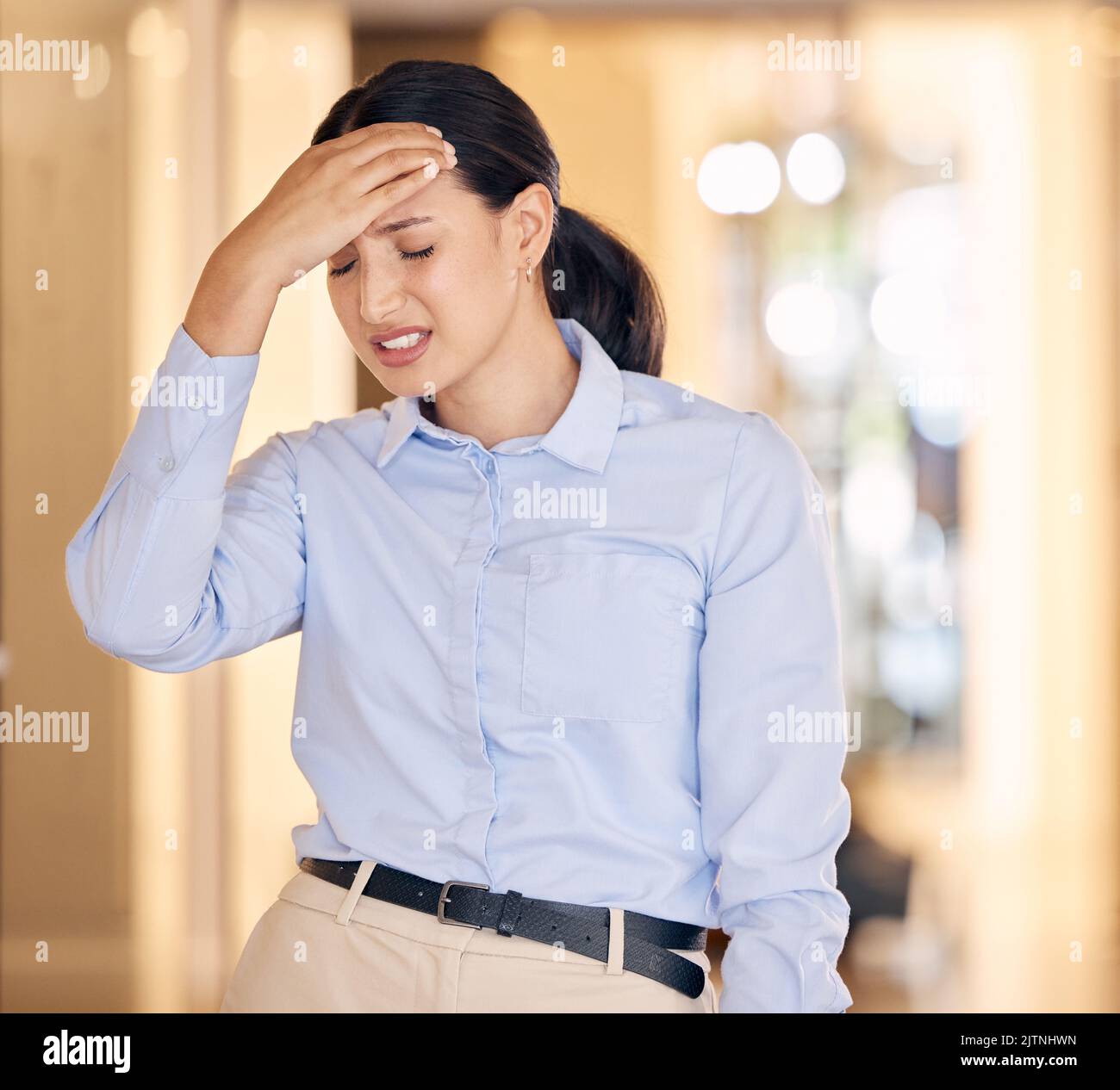 Stress, sick and tired business woman with a headache feeling sad and