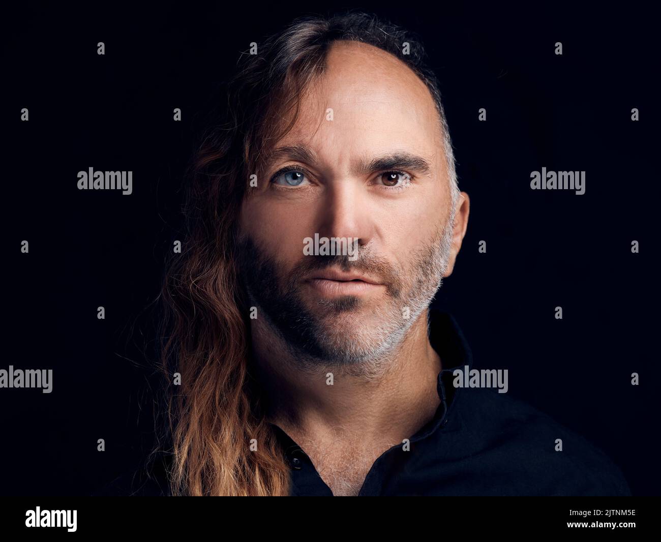 Portrait of diversity of men faces together showing age, face and hair differences. Closeup of a mature father with his young son on one body to show Stock Photo