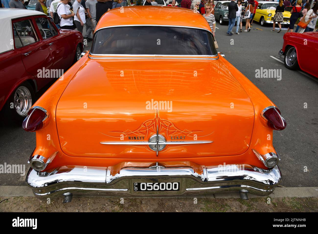 1956 Orange Oldsmobile ninety-eight Coupe at the Cooly Rocks On retro Festival at Coolangatta in the Gold Coast, Queensland, Australia Stock Photo