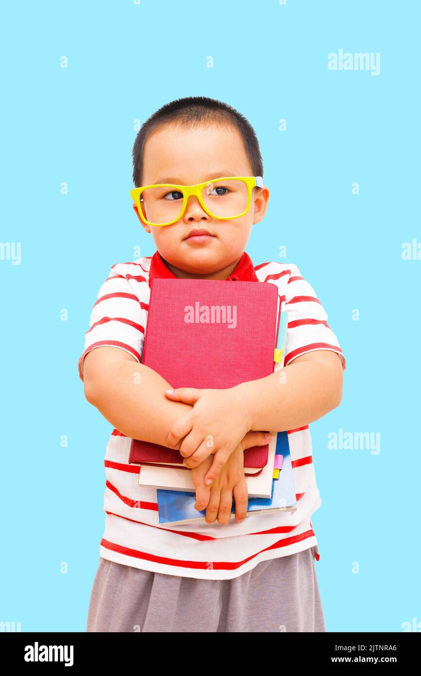 Little boy hold a book with isolated white background Stock Photo - Alamy