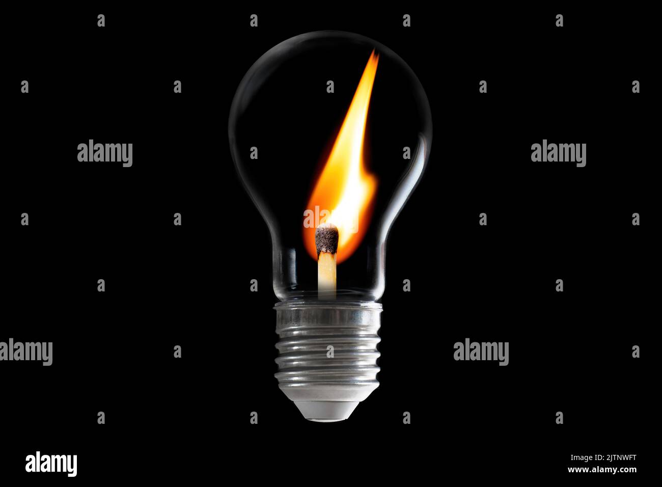 Oldfashioned incandescent lightbulb with a burning matchstick inside