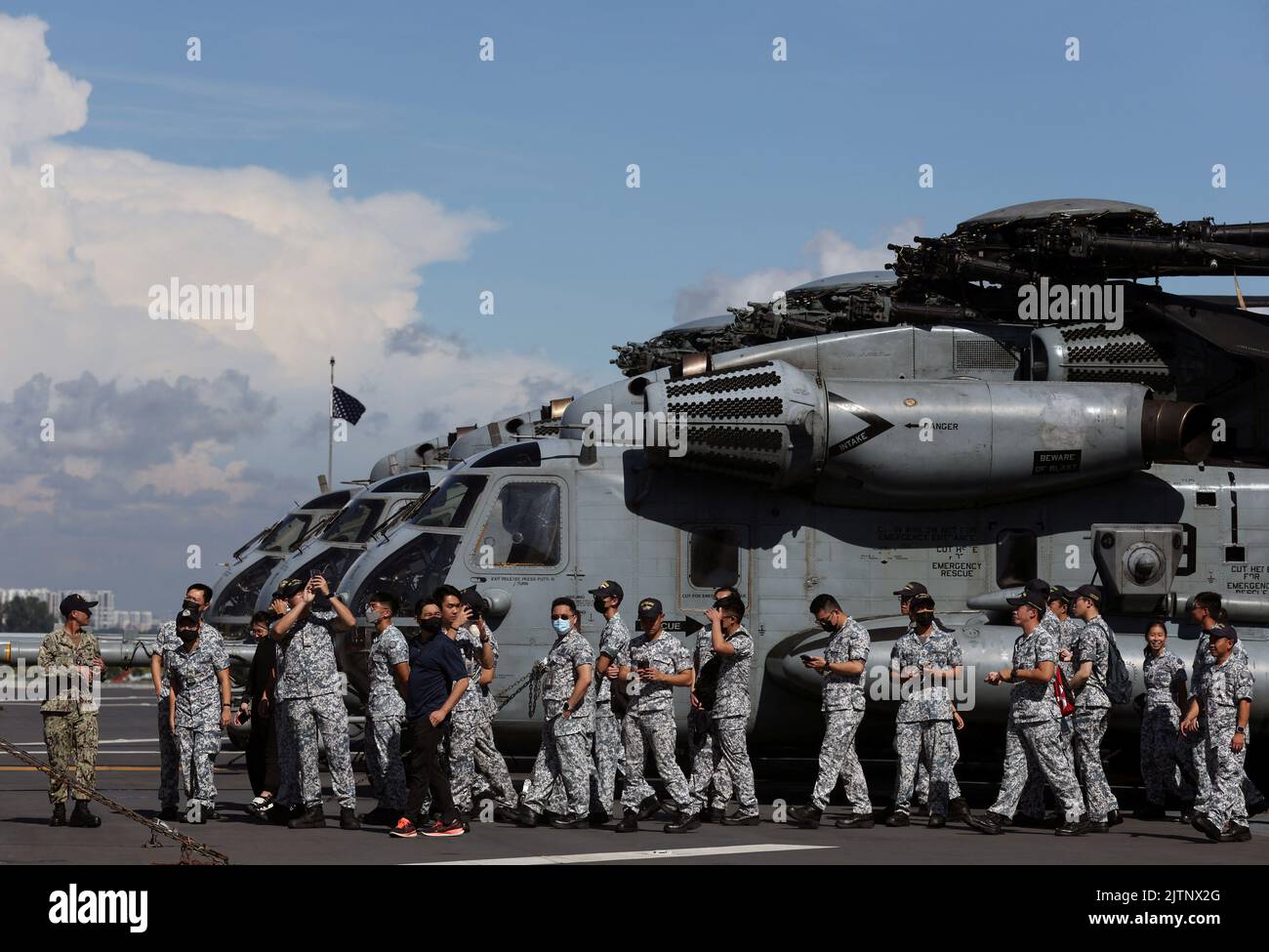 Republic of Singapore Navy personnel are given a tour on the flight deck of the USS Tripoli (LHA-7) at Changi Naval Base in Singapore September 1, 2022. REUTERS/Edgar Su Stock Photo