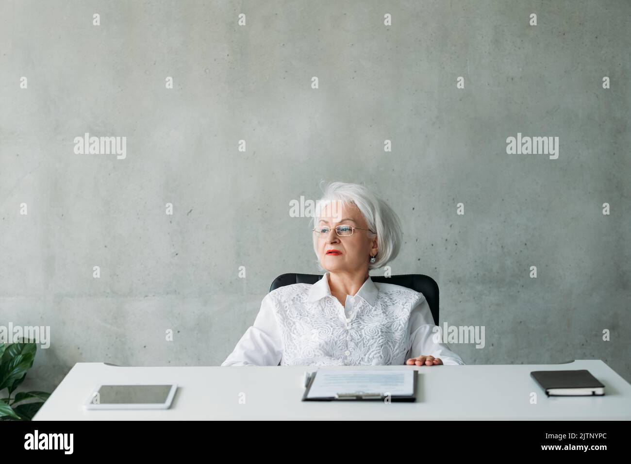 senior business woman contemplation planning Stock Photo