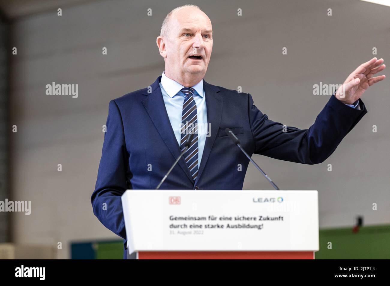 Peitz, Germany. 31st Aug, 2022. Dietmar Woidke, Minister President of the State of Brandenburg, speaks at the signing of the training pact between Deutsche Bahn and LEAG. The agreement is signed by the personnel directors of Deutsche Bahn, Seiler, and LEAG, Waniek. From 2025, Deutsche Bahn will take over the training workshop of the Lusatian energy company LEAG at the Jänschwalde power plant in the Spree-Neiße district. Credit: Frank Hammerschmidt/dpa/Alamy Live News Stock Photo