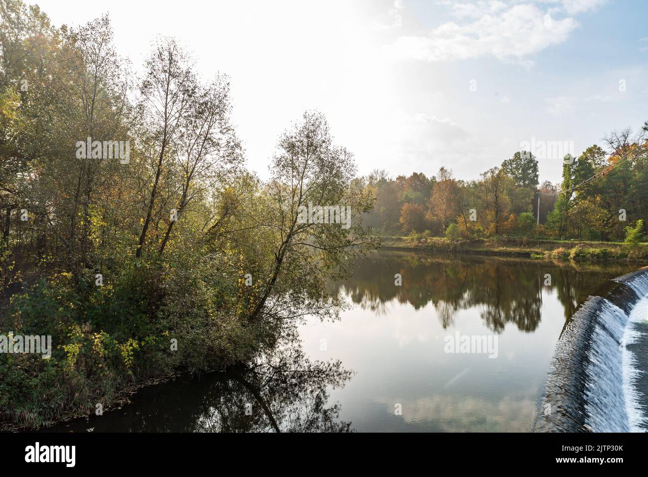 Wisla river near Skoczow town in Poland during autumn day wiith blue sky and clouds Stock Photo