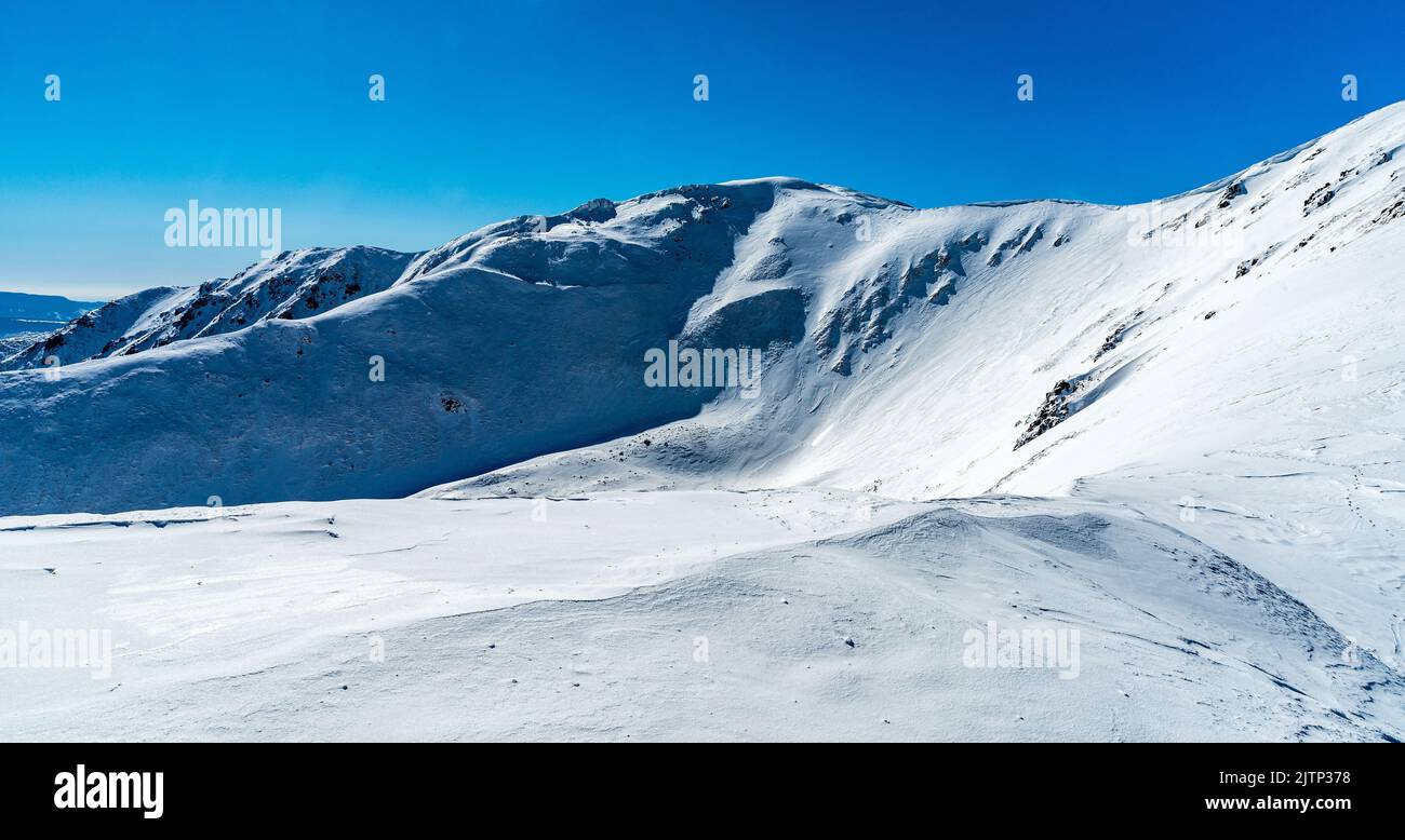 Skalka and Ziarska hola hills from hiking trail bellow Krizske sedlo mountain pass in winter Low Tatras mountains in Slovakia Stock Photo