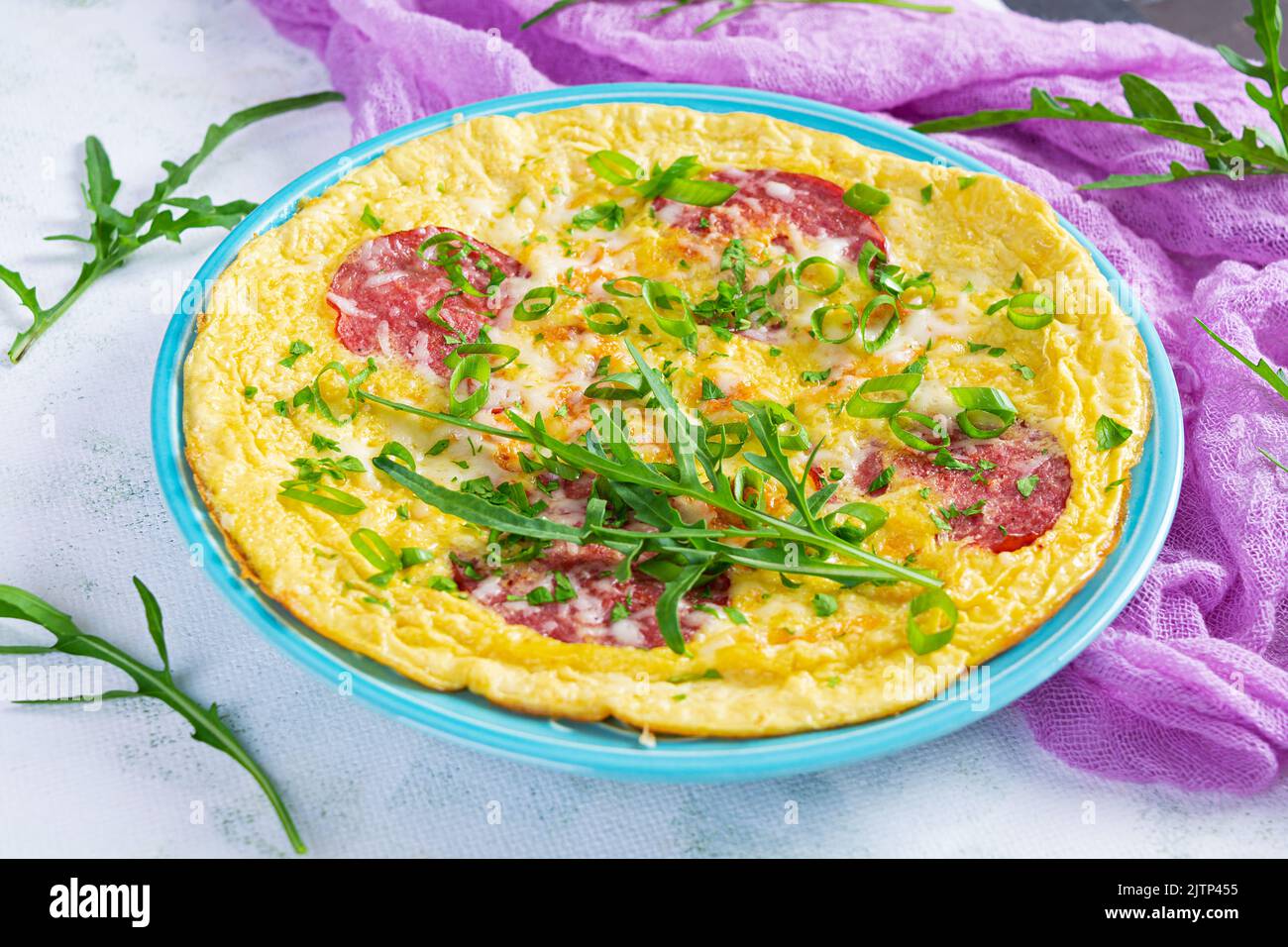 Omelette with sausage, herbs and grated cheese. Easy breakfast Stock