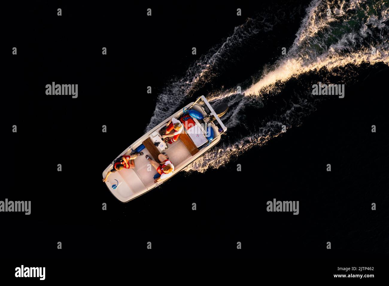 Aerial shot of a water rescue motorboat in evening light. Stock Photo