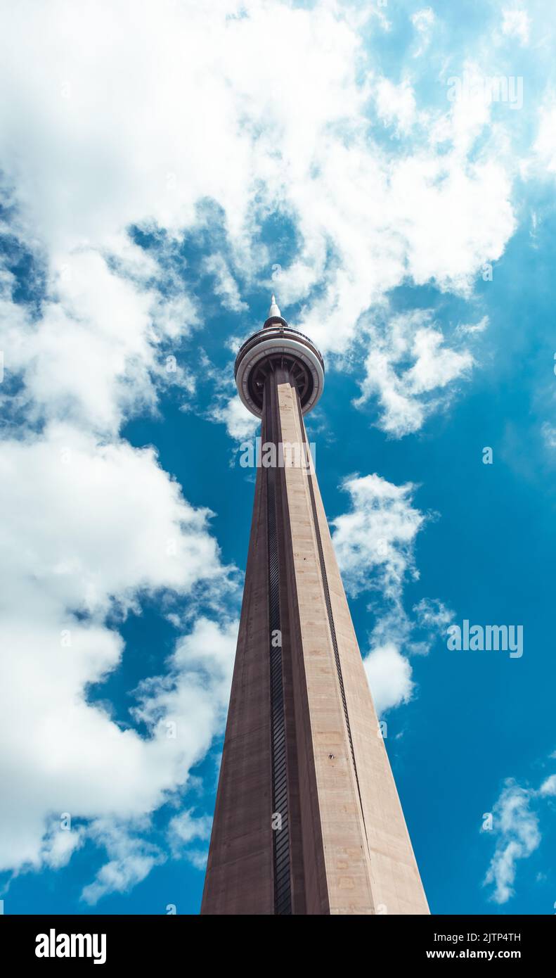 View from below of the CN Tower in downtown Toronto, Ontario. The CN Tower is a beautiful and popular landmark in Toronto. Stock Photo